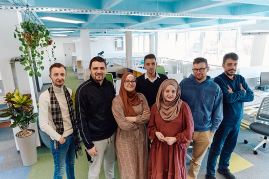 Portrait of a successful creative businessman and businesswoman looking at camera and smiling. Diverse business people standing together at startup. photo