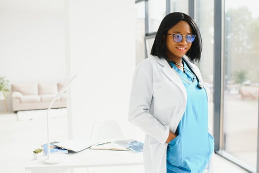 portrait of african female doctor at workplace. photo