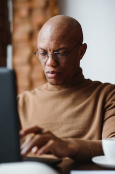 portrait of a serious african american man with glasses. photo