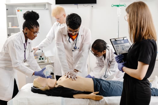 Medical Students Practicing CPR on a Training Dummy photo