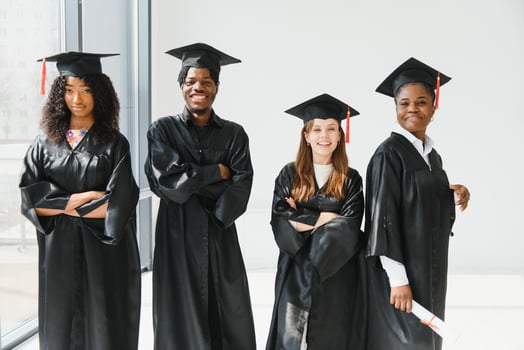 portrait of multiracial graduates holding diploma photo