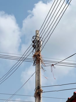 electrical wires on a pole on the background of the sky photo