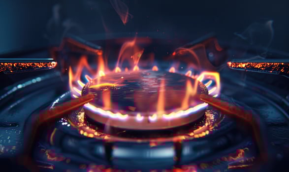 Extreme close-up of a gas cooktop burner emitting a steady flame photo
