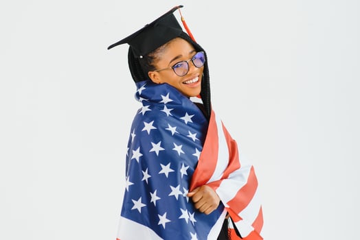 Happy female student with USA flag background. Studying in USA conceptual photo