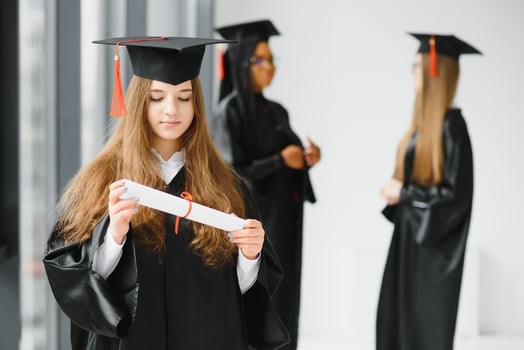 Educational theme graduating student girl in an academic gown. photo