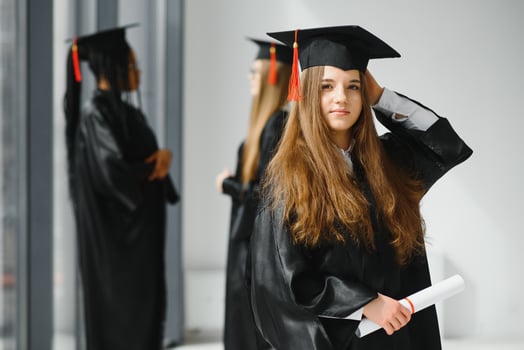 Educational theme graduating student girl in an academic gown. photo