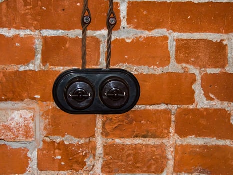retro switch in a loft interior on a bricks wall photo