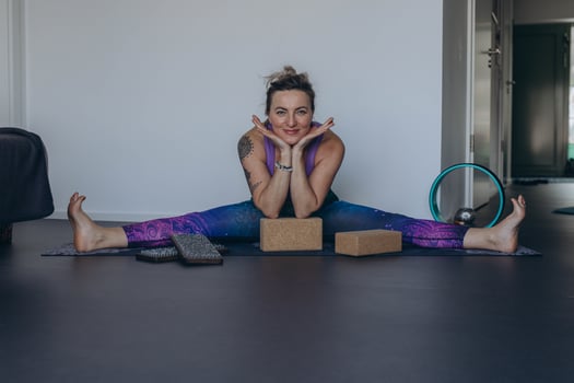 Attractive young woman practing yoga stretching yoga at home. photo