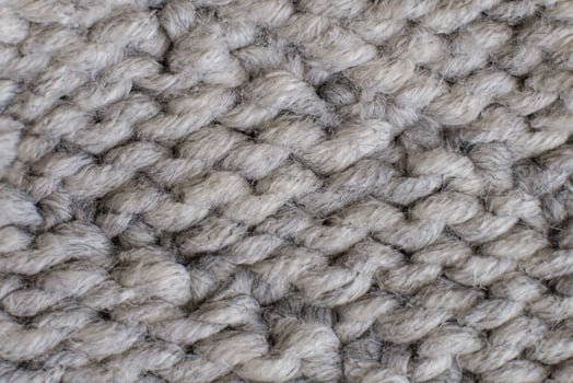 Close-Up Shot of Handcrafted Grey Knitting Wool Texture photo