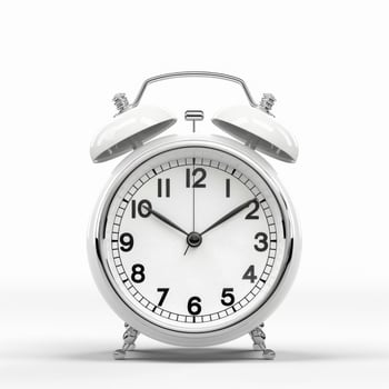 Classic white alarm clock with bells isolated on white background. photo