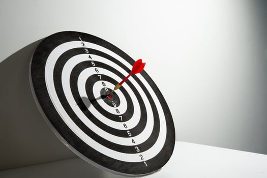 red dart hitting target background photo