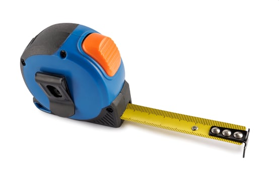 Blue measuring tape isolated on white background.Builder's tools photo