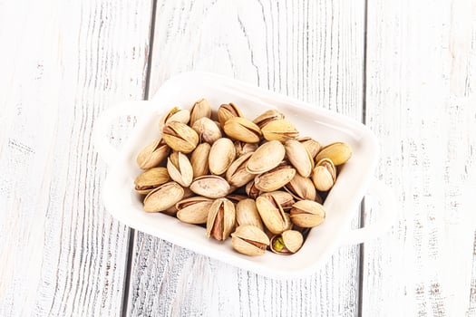 Salted tasty pistachio nuts heap photo