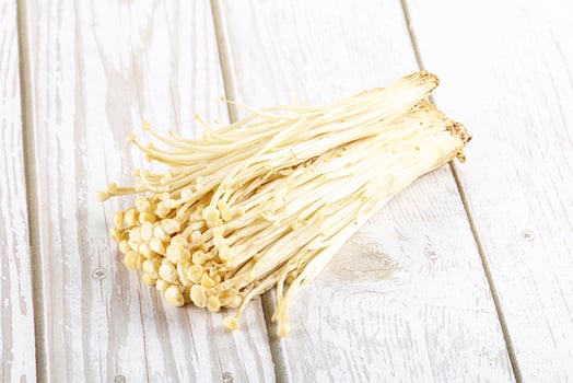 Tasty raw enoki mushroom heap photo