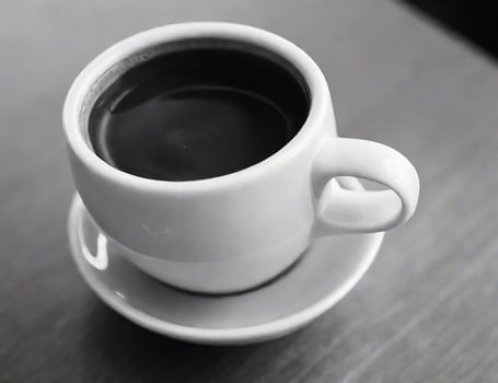 Ceramic coffee cup closeup view in black and white photo