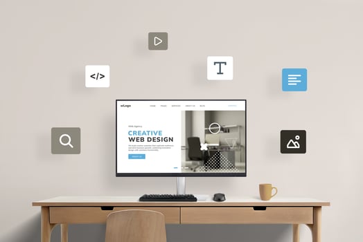 Work desk with computer display featuring web design studio presentation page, surrounded by flying web design icons. Visual representation of a creative digital workspace concept photo