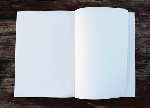 White paper sheet on the wooden table outdoors photo
