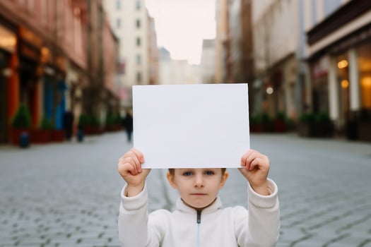 child hand hold blank paper photo