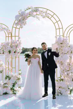 wedding ceremony of the newlyweds on the pier photo