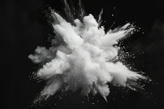 White paint explosion splash abstract background. Milk cloud, dust explode on black photo