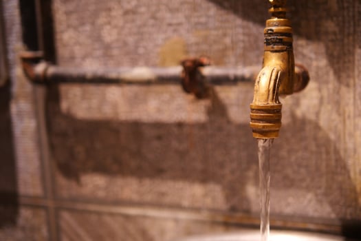 Water drop from water tap. photo