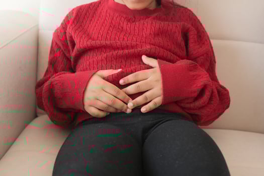 child suffering stomach pain close up. photo