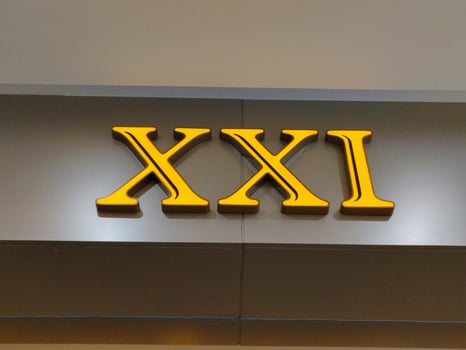 The xxxi sign is displayed on the wall of a building photo
