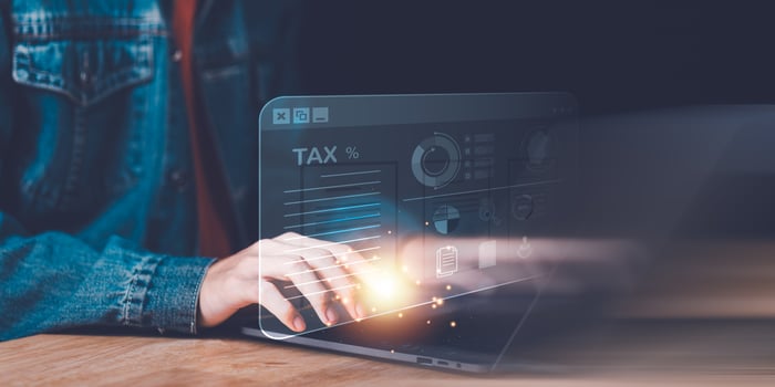 Business people planning annual tax deduction, tax rate calculation, and business financial budget, effective tax deduction planning ideas for individuals and companies,document management system photo