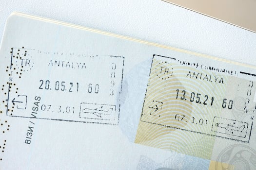 KYIV, UKRAINE - APRIL 20, 2024 Page of foreign passport with visas, Turkiye border stamps, permits to enter countries, concept of traveling around the world, travelers document photo