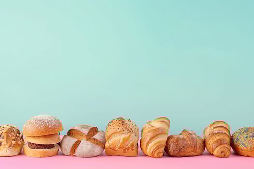 Assorted Fresh Pastries on Blue Background with . photo