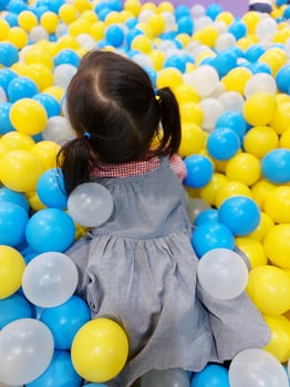 Children play in the children's playground in the mall area enjoying the holiday period, doing positive activities and having fun photo