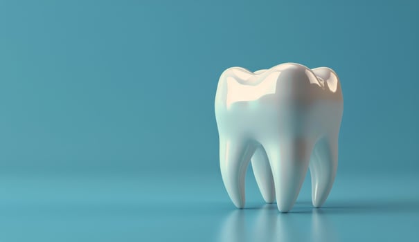 White Tooth Model on Blue Background photo