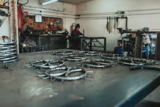 Pieces of steel lined up on the table ready for the welding process photo
