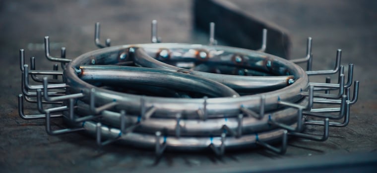 Pieces of steel lined up on the table ready for the welding process photo