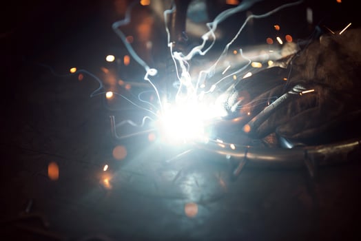 Close up of the steel welding process. Work in the heavy steel industry photo