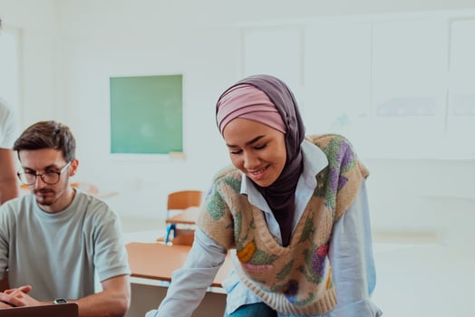 A businesswoman wearing a hijab leads a corporate meeting with a wide smile, showcasing her professionalism, confidence, and inclusive leadership in modern attire photo