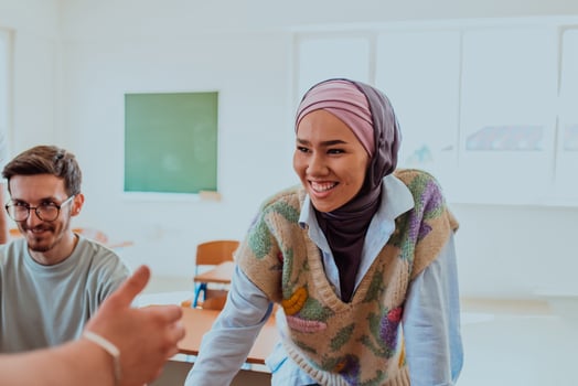 A businesswoman wearing a hijab leads a corporate meeting with a wide smile, showcasing her professionalism, confidence, and inclusive leadership in modern attire photo
