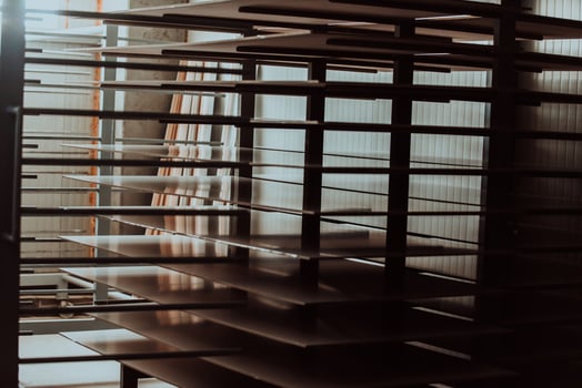 A vast warehouse in the forestry industry, showcasing a plethora of wooden products, including boards and various timber items neatly organized in storage photo