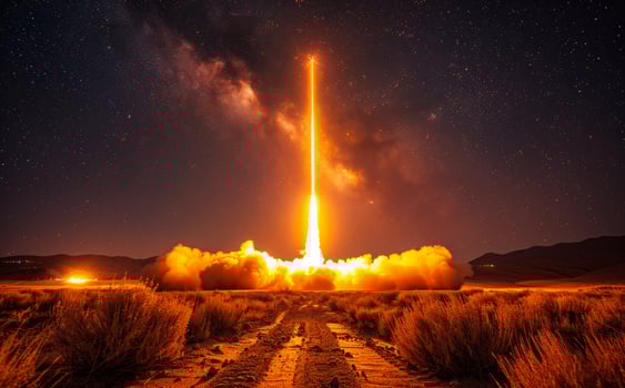 Rocket launches into the sky with trail of fire photo