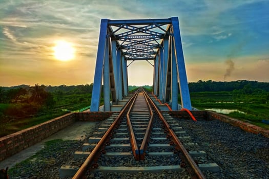 sunset time railroad bridges and train travel photo