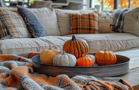 White Pumpkin and Dried Flowers Centerpiece on Rustic Coffee Table photo