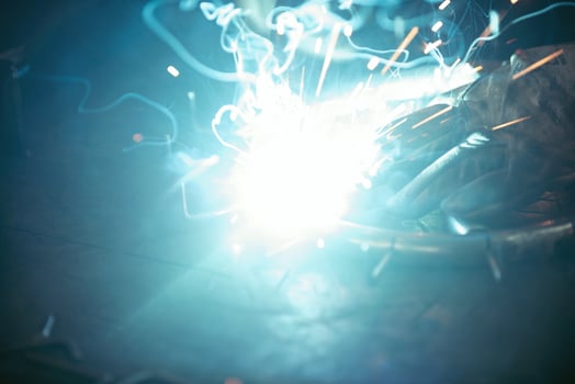 Close up of the steel welding process. Work in the heavy steel industry photo