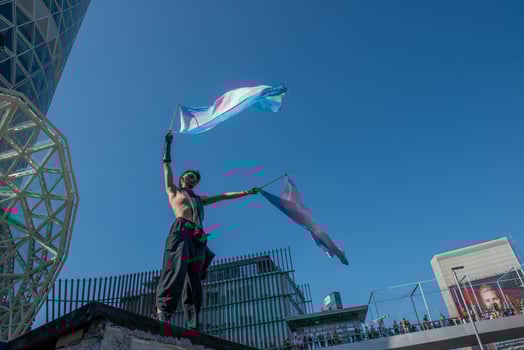 Milan Italy 2024 Transsexual girl protesting by waving the flag for gender freedom photo