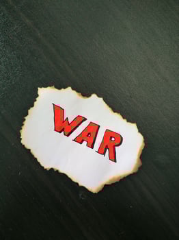 the paper that was burnt on the edge said WAR photo