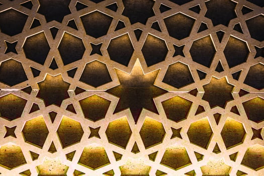 Colorful vintage surface with an old oriental pattern. The background is a texture that has a decorative value. For overlay or texture designs photo