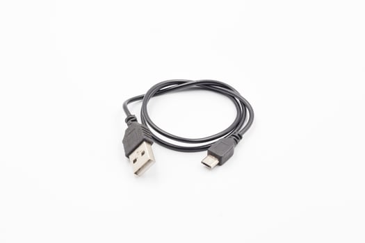 USB cable for smartphone on white background, Black usb cable on white background, computer peripherals connector or smartphone recharge supply photo