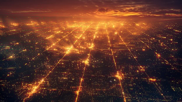 A cityscape at night lit up by the warm glow of hundreds of solarpowered streetlights photo