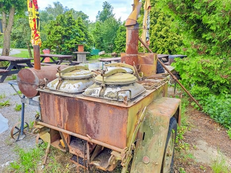 Military field kitchen of World War II is installed in the park for cooking photo