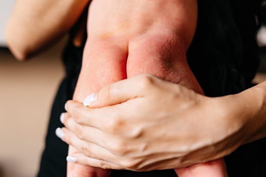 parent's hands hold baby's back in frame, cute parenthood photo