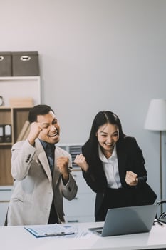 Two happy friendly diverse professionals, teacher and student giving high five standing in office celebrating success, good cooperation result, partnership teamwork and team motivation in office work. photo